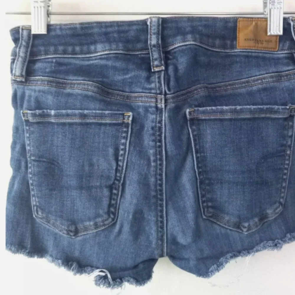 American Eagle Outfitters Distressed Denim Shorts Size 4 Raw Hem Blue Festival